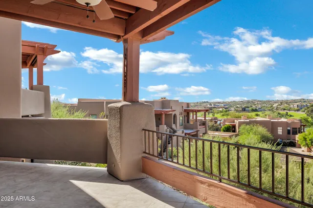 a view of a balcony with city view