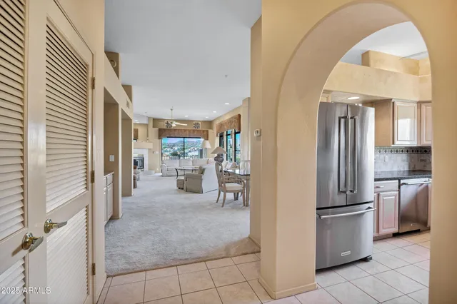 a view of a kitchen with a sink and refrigerator