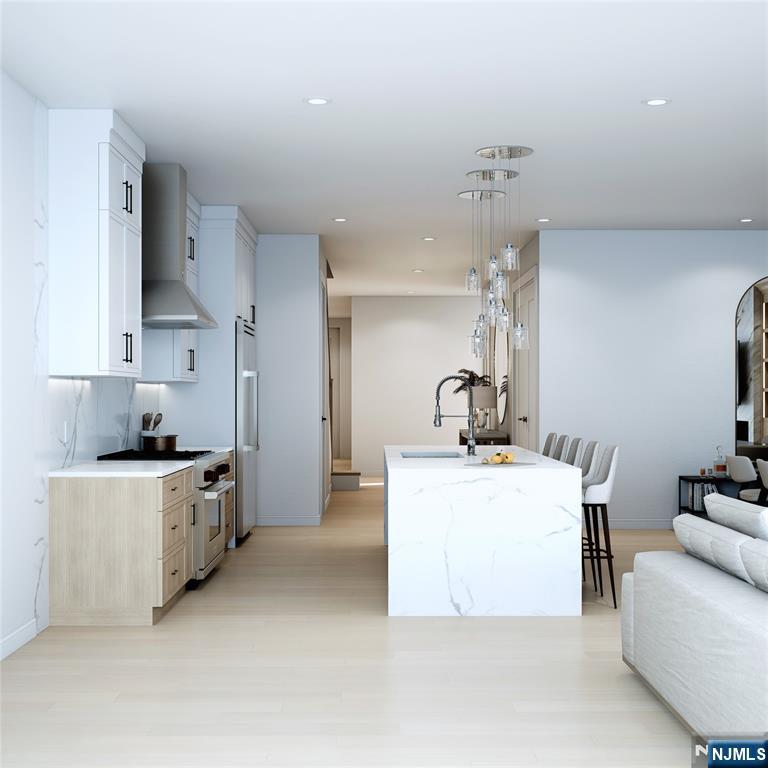 14 Feldman Court Paramus, NJ 07652 - Photo 6 of 24 a kitchen with stainless steel appliances a sink stove and cabinets