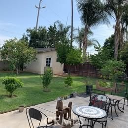 1320 3 Ranch Road Duarte, CA 91010 - Photo 3 of 16 a backyard of a house with table and chairs plants and large tree