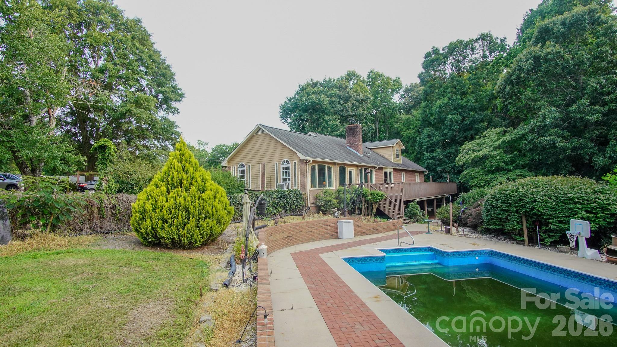 204 Old Stage Coach Road Lawndale, NC 28090 - Photo 10 of 33 a front view of a house with garden
