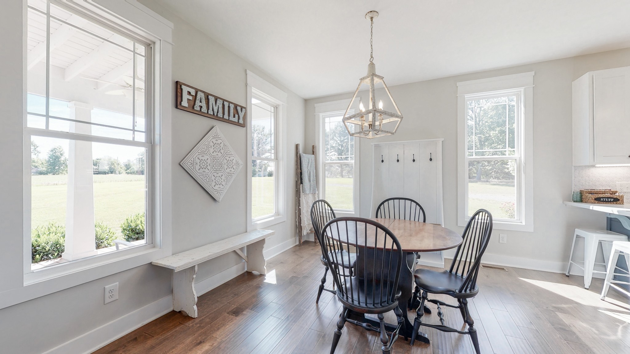 489 S Road Cottontown, TN 37048 - Photo 19 of 46 a dining room with furniture a chandelier and wooden floor