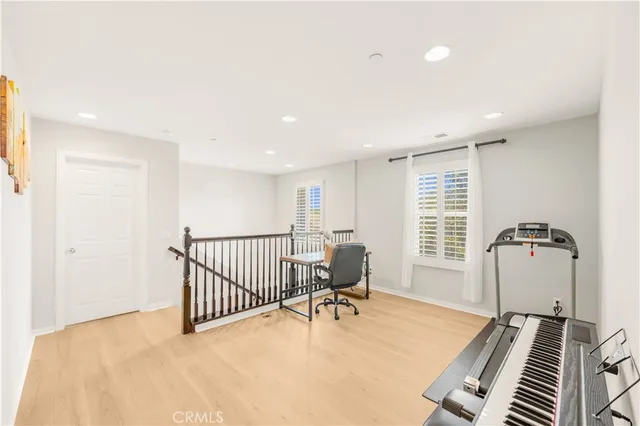 a bedroom with furniture and a window