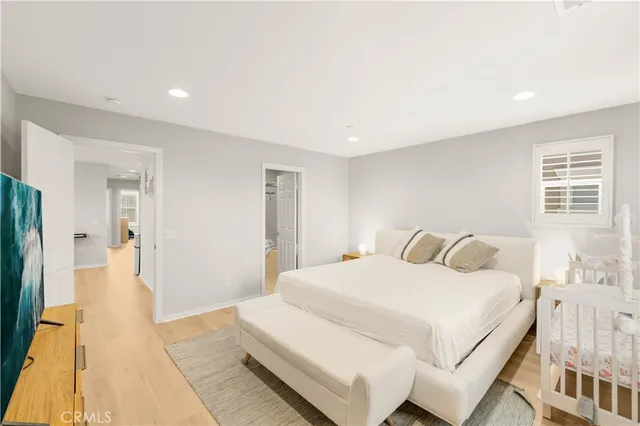 a bedroom with a bed and a table