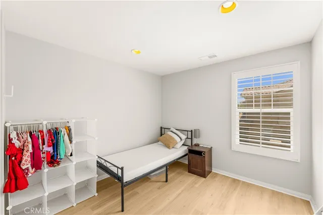 a living room with furniture and a book shelf
