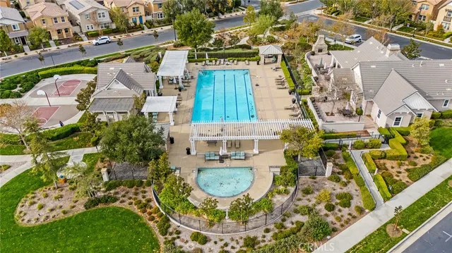 an aerial view of residential house with outdoor space and swimming pool