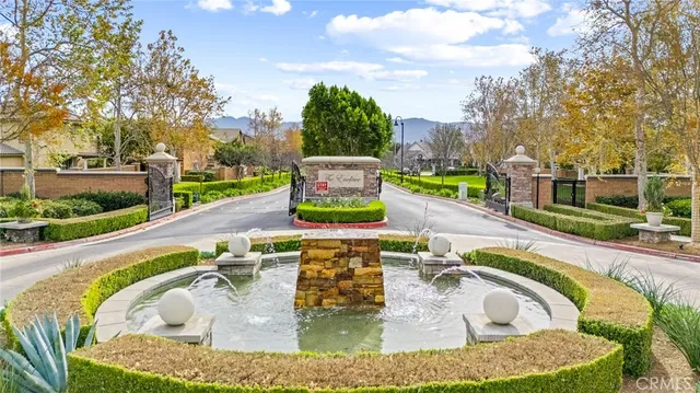 a view of a house with backyard porch and sitting area