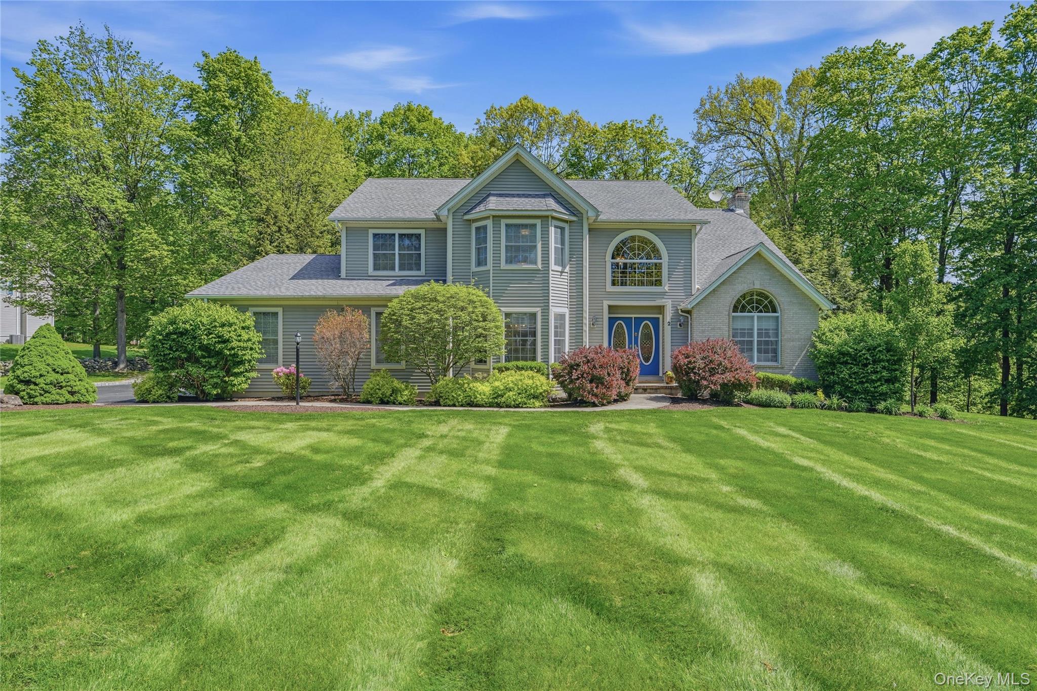 2 Windsor Lane Cornwall, NY 12518 - Photo 1 of 50 a front view of a house with a garden