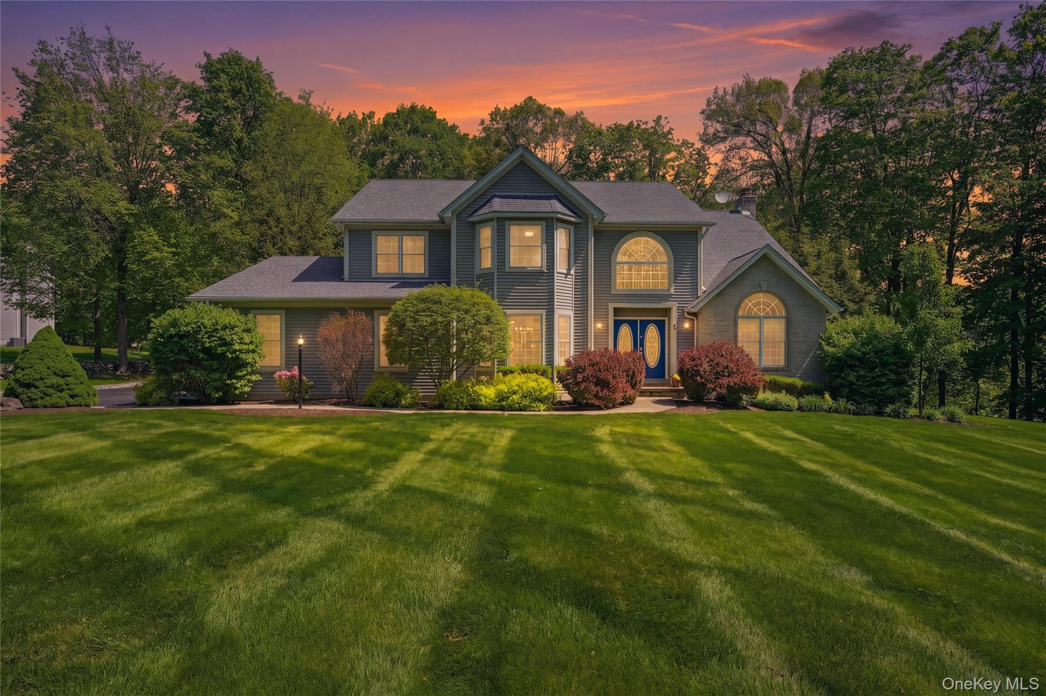 2 Windsor Lane Cornwall, NY 12518 - Photo 2 of 50 a front view of a house with a yard