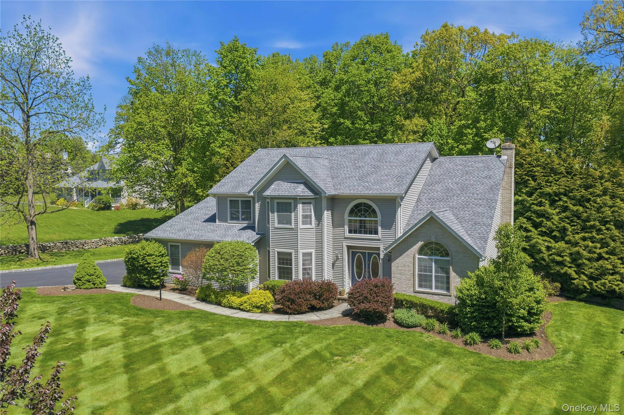 2 Windsor Lane Cornwall, NY 12518 - Photo 8 of 50 a front view of a house with garden
