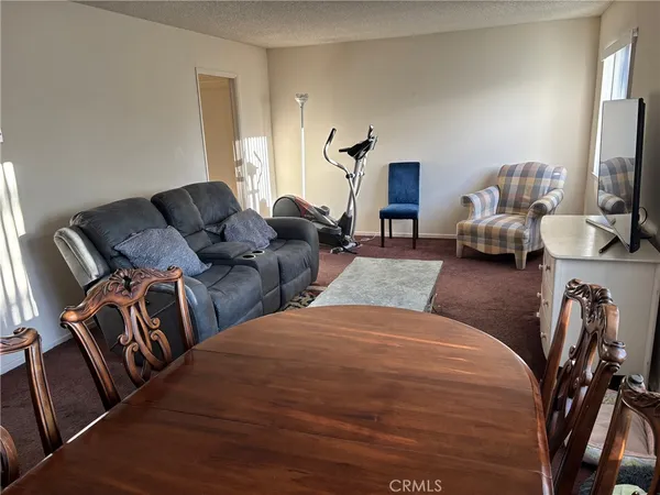 a bedroom with bed and a couch