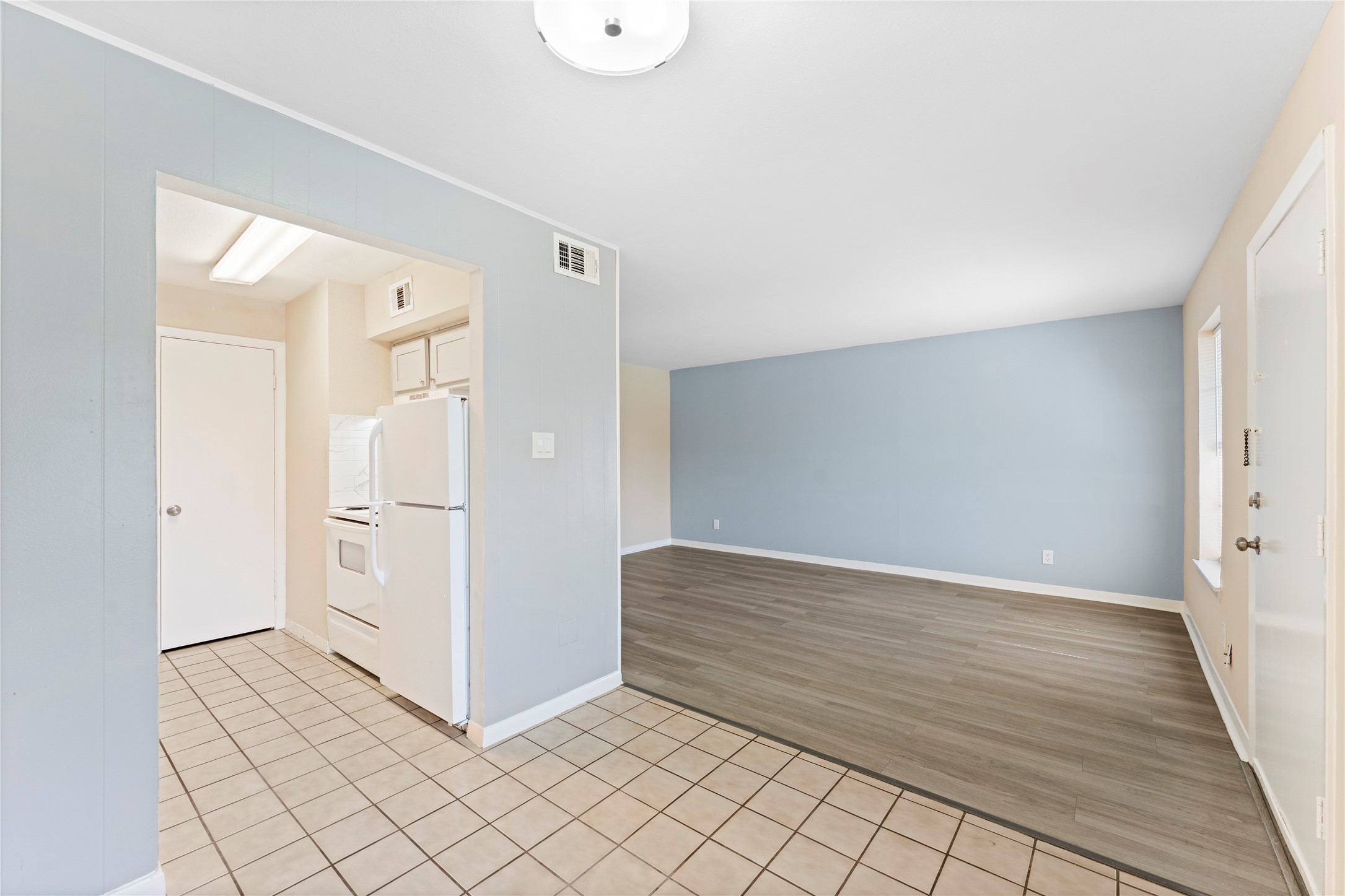 3316 Burke Road, Unit 43 Pasadena, TX 77504 - Photo 6 of 15 a view of a refrigerator in kitchen and white cabinets