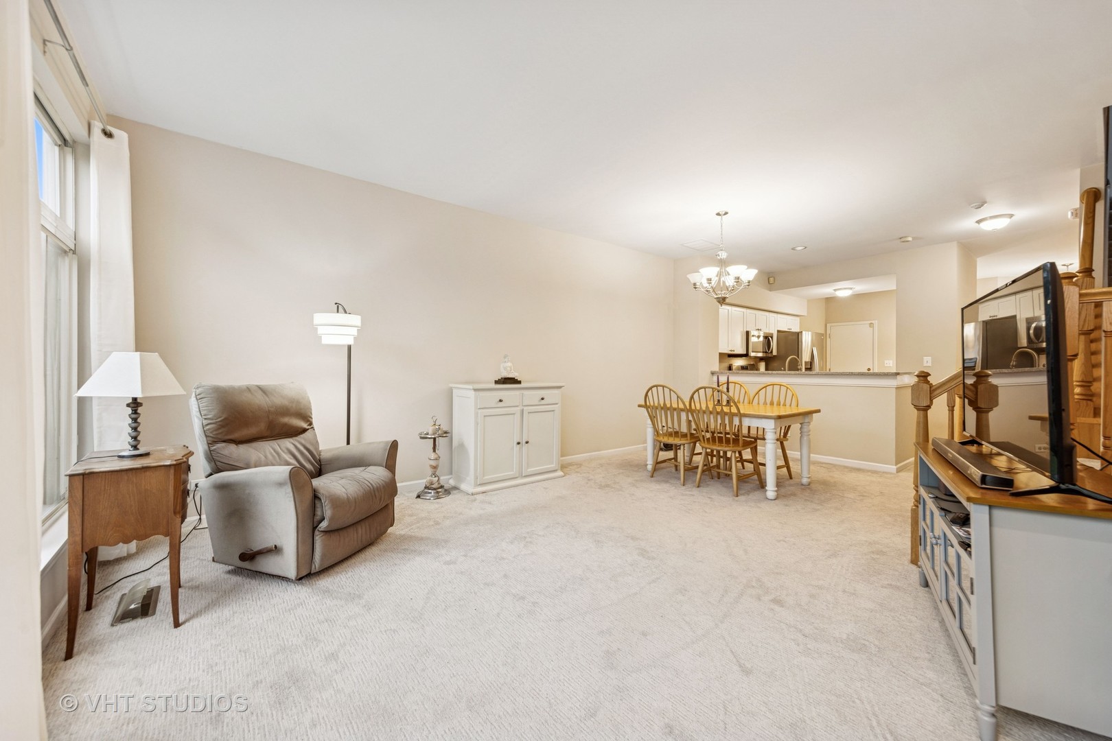 8291 Ripple Ridge, Unit 8291 Darien, IL 60561 - Photo 11 of 23 a living room with furniture and a flat screen tv