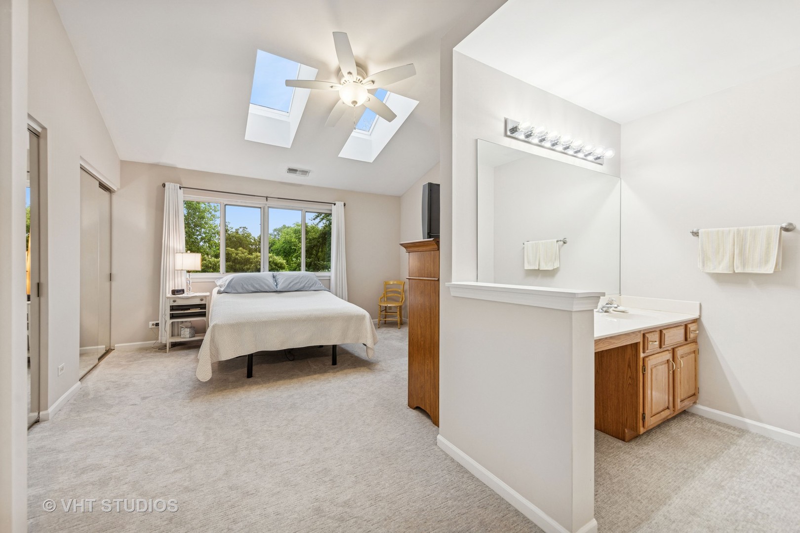 8291 Ripple Ridge, Unit 8291 Darien, IL 60561 - Photo 14 of 23 a bedroom with furniture and a mirror