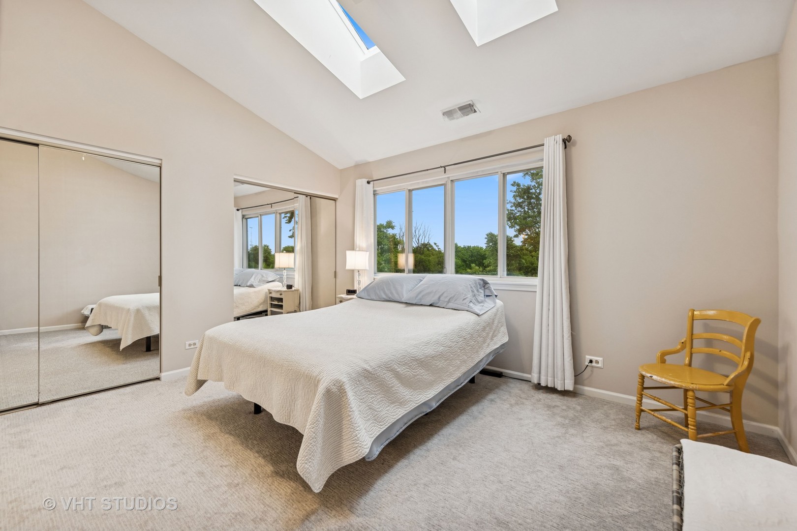 8291 Ripple Ridge, Unit 8291 Darien, IL 60561 - Photo 15 of 23 a spacious bedroom with a bed and window