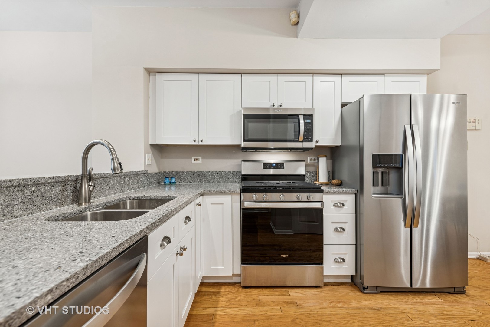 8291 Ripple Ridge, Unit 8291 Darien, IL 60561 - Photo 7 of 23 a kitchen with a sink stove and refrigerator