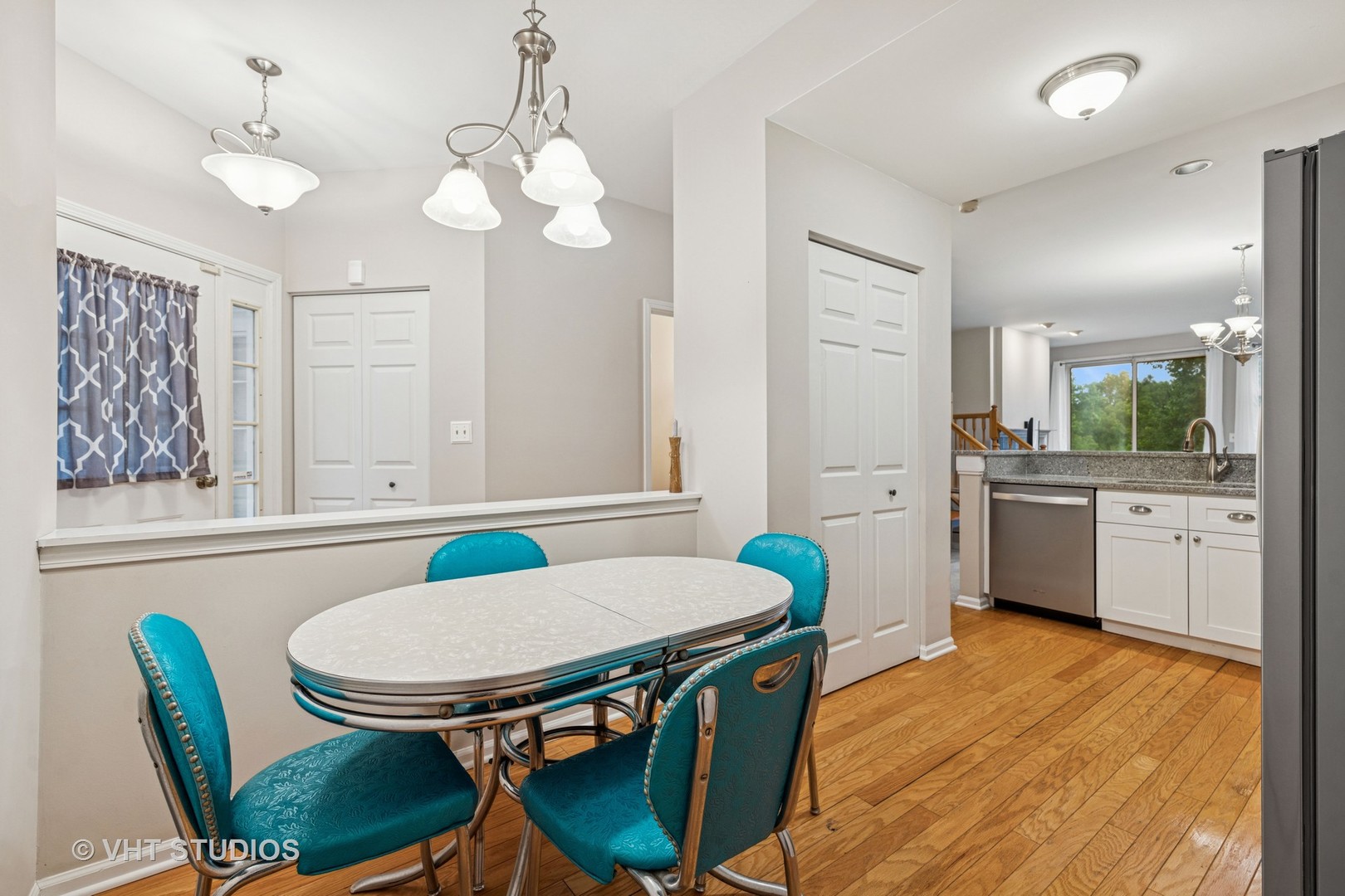 8291 Ripple Ridge, Unit 8291 Darien, IL 60561 - Photo 8 of 23 a view of a dining room with furniture and wooden floor