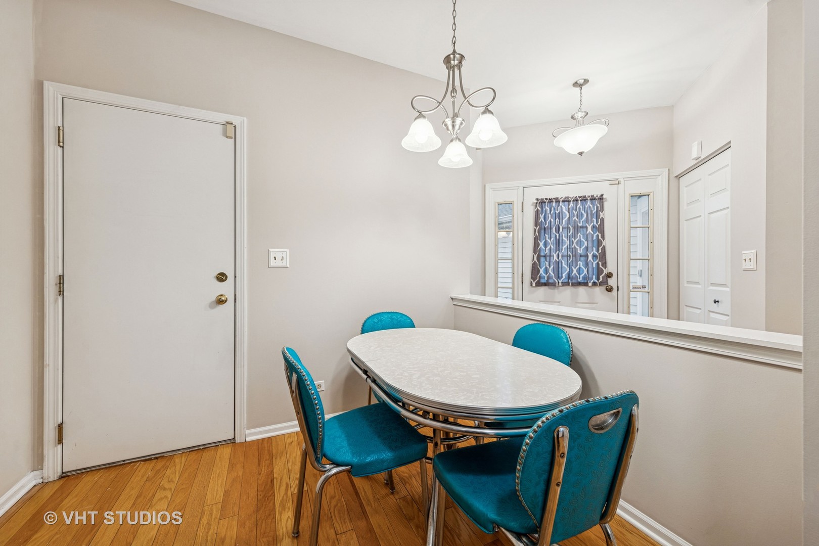 8291 Ripple Ridge, Unit 8291 Darien, IL 60561 - Photo 9 of 23 a view of a dining room with furniture and chandelier