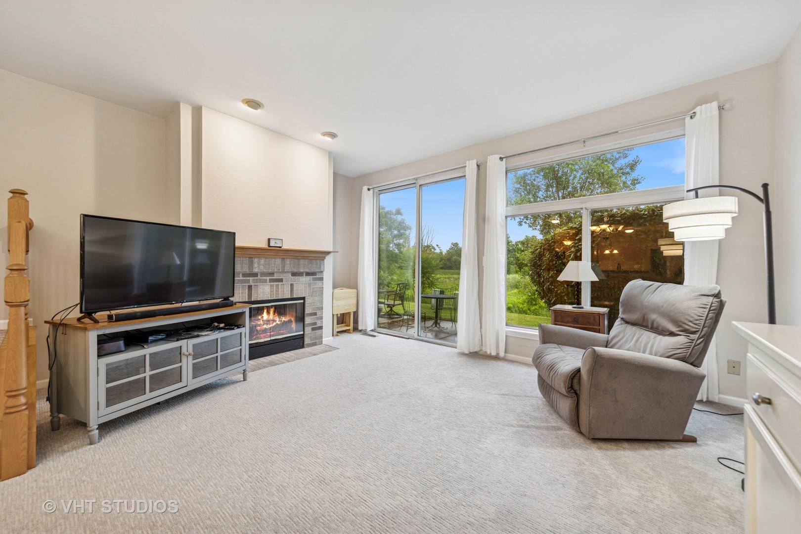 8291 Ripple Ridge, Unit 8291 Darien, IL 60561 - Photo 10 of 23 a living room with furniture and a flat screen tv