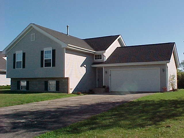 765 Bayfield Road Rockton, IL 61073 - Photo 1 of 18 a front view of house with yard