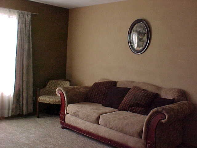 765 Bayfield Road Rockton, IL 61073 - Photo 5 of 18 a living room with a couch and a window