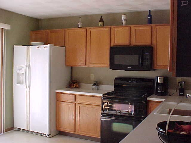 765 Bayfield Road Rockton, IL 61073 - Photo 6 of 18 a kitchen with a refrigerator stove and microwave