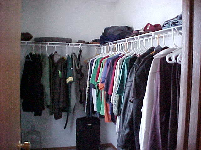 765 Bayfield Road Rockton, IL 61073 - Photo 9 of 18 a view of walk in closet with clothes and shoes