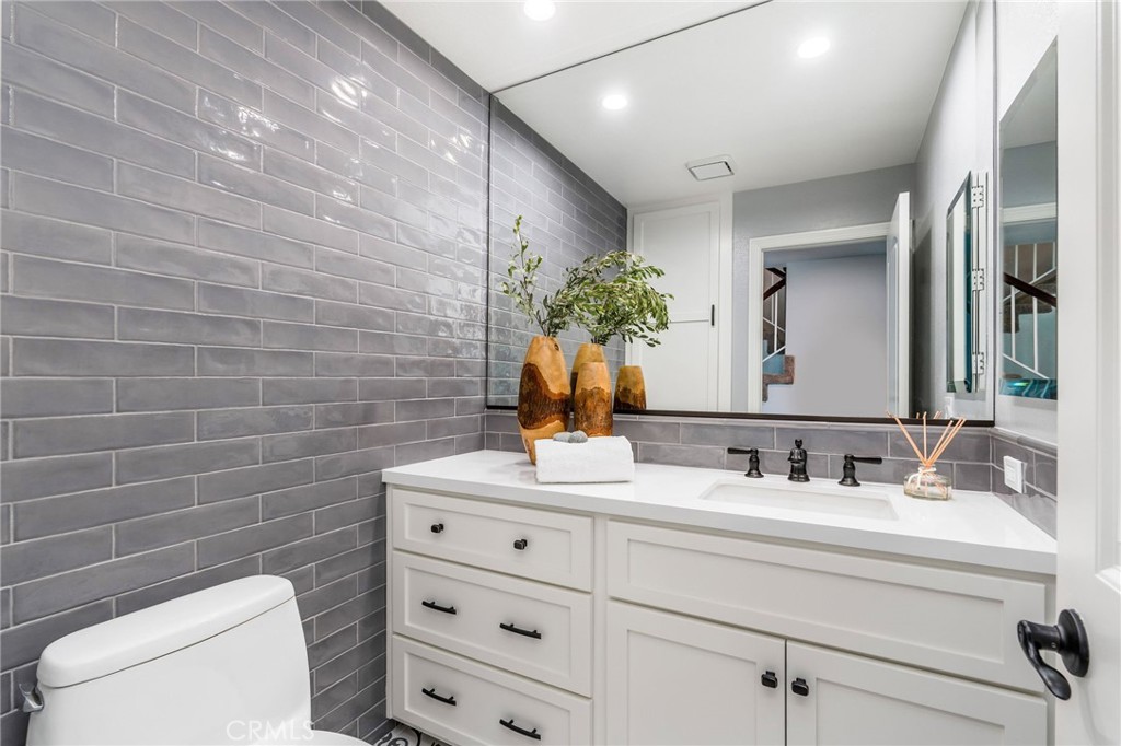 30392 North Hampton Road Laguna Niguel, CA 92677 - Photo 12 of 44 a bathroom with a toilet sink and mirror