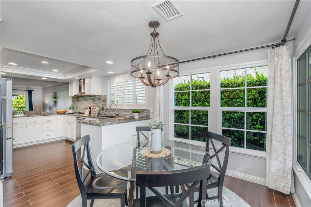 30392 North Hampton Road Laguna Niguel, CA 92677 - Photo 17 of 44 a kitchen with a table and chairs in it