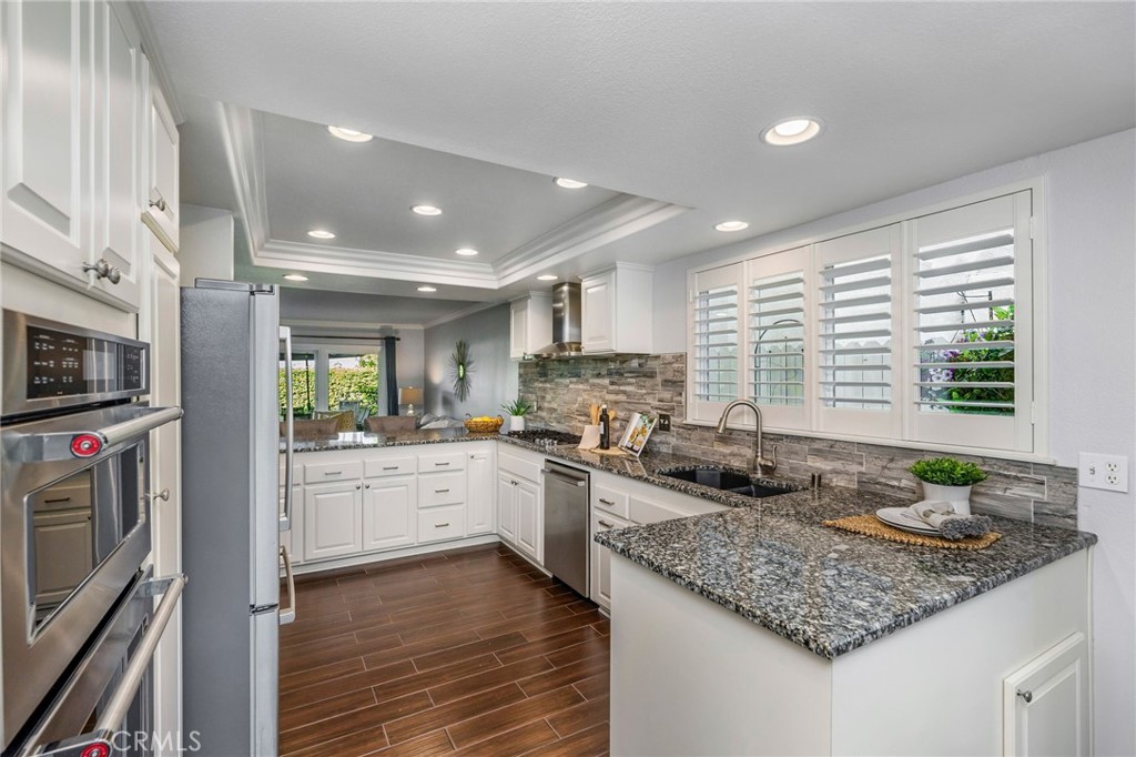 30392 North Hampton Road Laguna Niguel, CA 92677 - Photo 18 of 44 a kitchen with lot of counter space and stainless steel appliances
