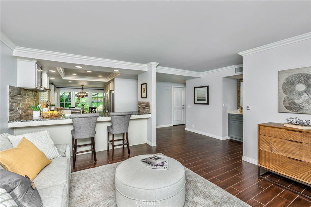 30392 North Hampton Road Laguna Niguel, CA 92677 - Photo 22 of 44 a living room with furniture and a dining table with wooden floor