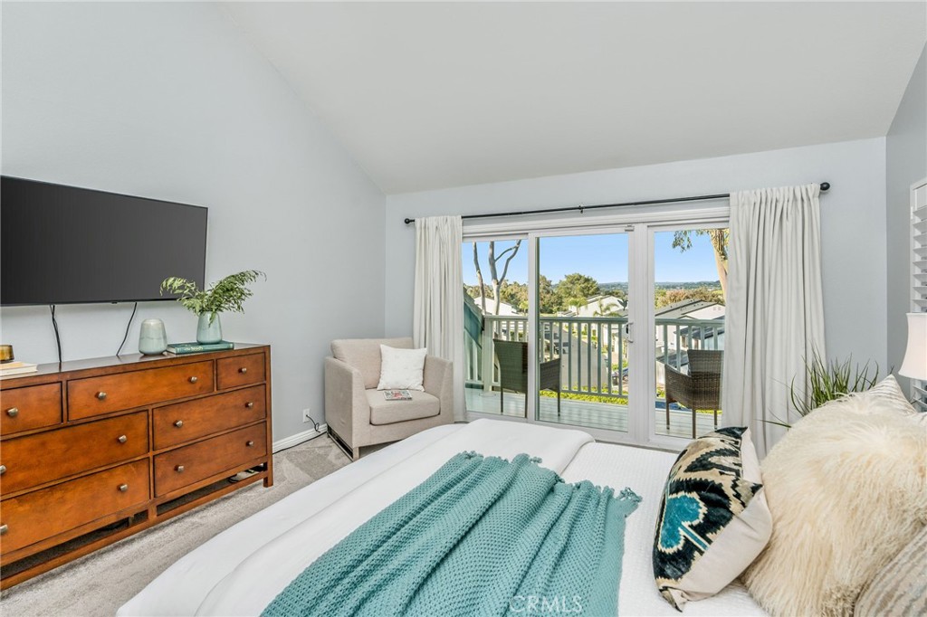 30392 North Hampton Road Laguna Niguel, CA 92677 - Photo 26 of 44 a bedroom with a bed and large window