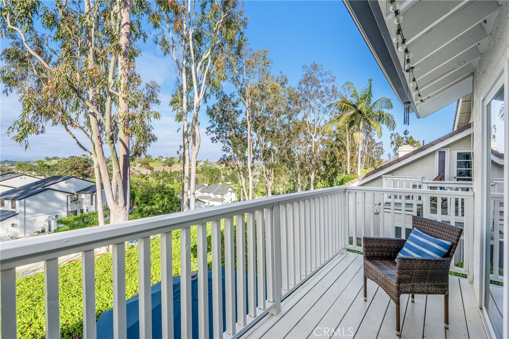 30392 North Hampton Road Laguna Niguel, CA 92677 - Photo 27 of 44 a view of a balcony with wooden chairs and floor and wooden fence