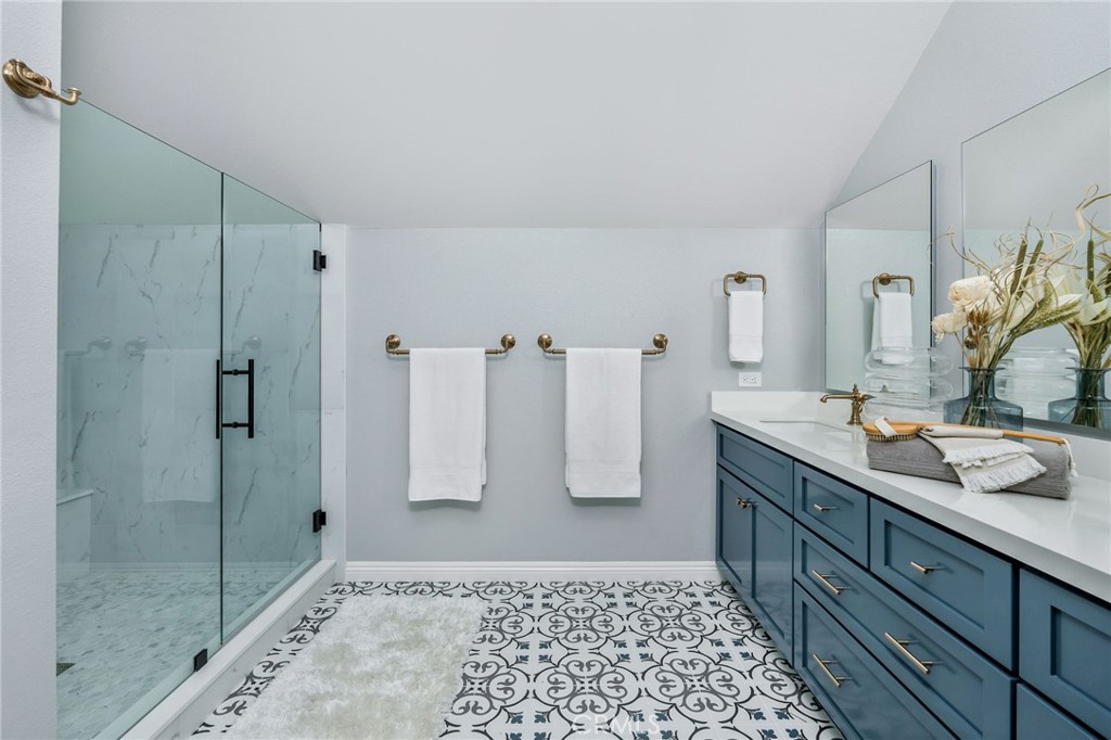 30392 North Hampton Road Laguna Niguel, CA 92677 - Photo 28 of 44 a bathroom with a double sink shower and a mirror