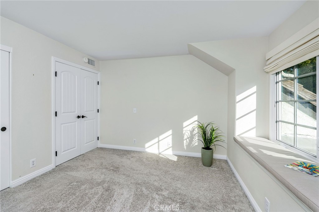 30392 North Hampton Road Laguna Niguel, CA 92677 - Photo 35 of 44 a living room with furniture and a potted plant