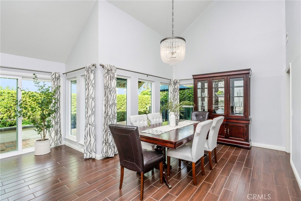 30392 North Hampton Road Laguna Niguel, CA 92677 - Photo 9 of 44 a view of a dining room with furniture wooden floor and chandelier