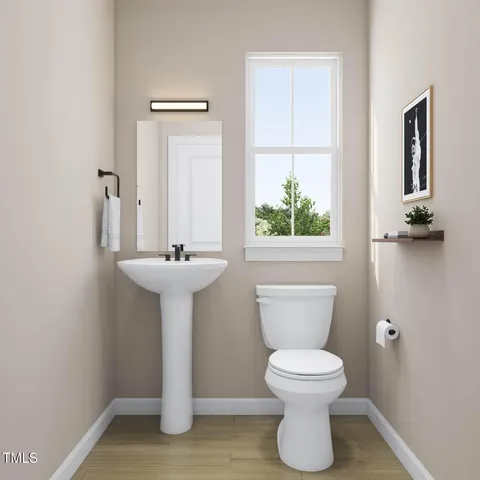 a view of kitchen with wooden floor and electronic appliances