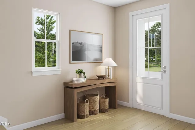 a view of room with window and wooden floor