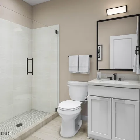 a bathroom with a granite countertop sink toilet a mirror and shower