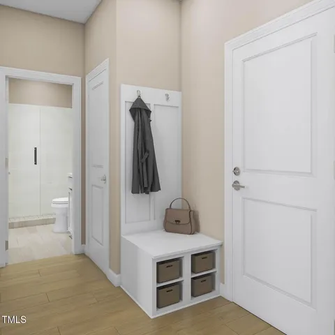 a room with a white cabinets and a wooden floor