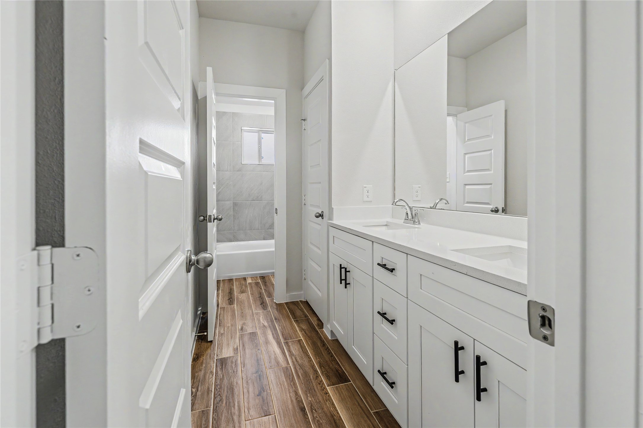 6427 Bolinas Court Rosharon, TX 77583 - Photo 35 of 49 a bathroom with a double vanity sink and mirror with shower