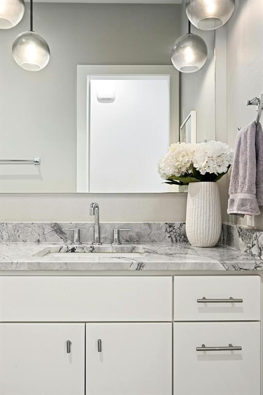 5212 Huisache Street, Unit 2 Austin, TX 78751 - Photo 19 of 30 Half bathroom with vanity