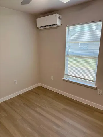 a view of a room that has a window in it
