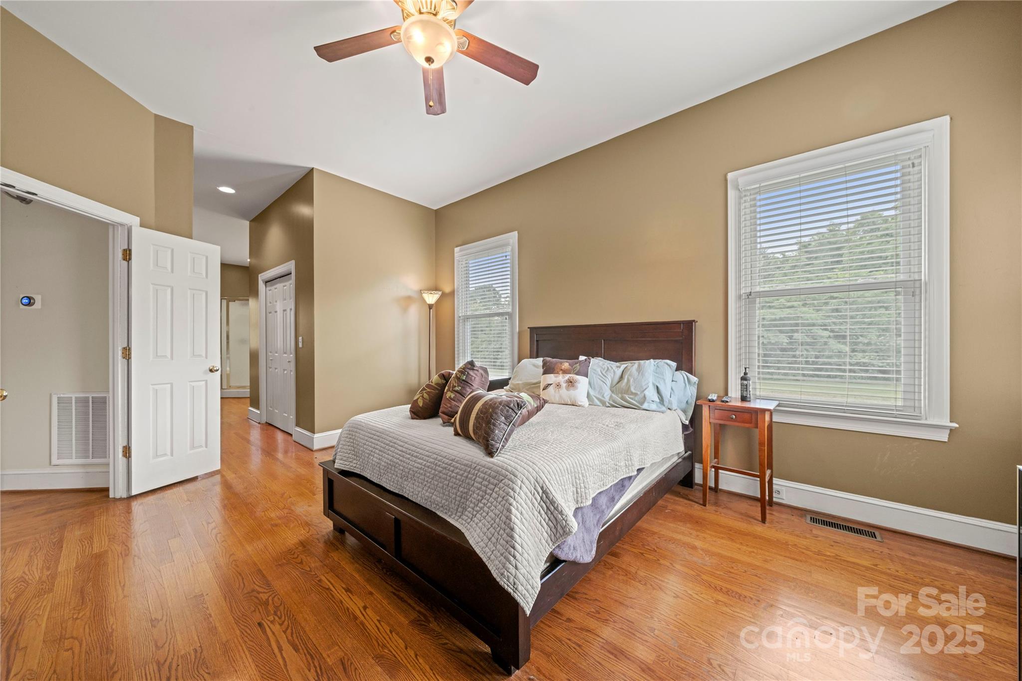 6218 Indian Trail Fairview Road Indian Trail, NC 28079 - Photo 13 of 46 a bedroom with a bed and a chandelier