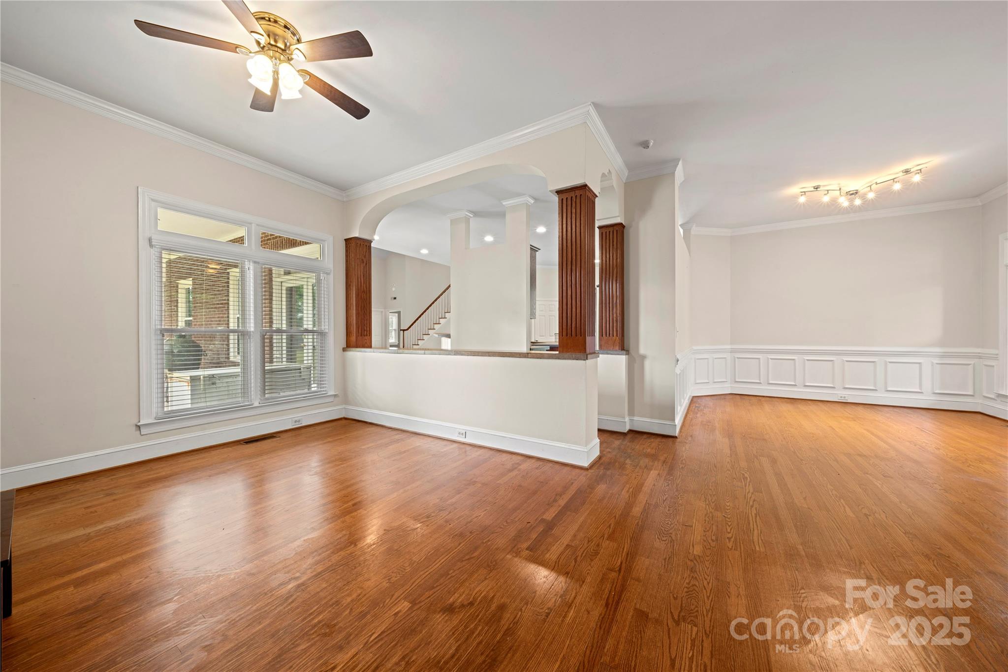 6218 Indian Trail Fairview Road Indian Trail, NC 28079 - Photo 19 of 46 a view of empty room with wooden floor and fan