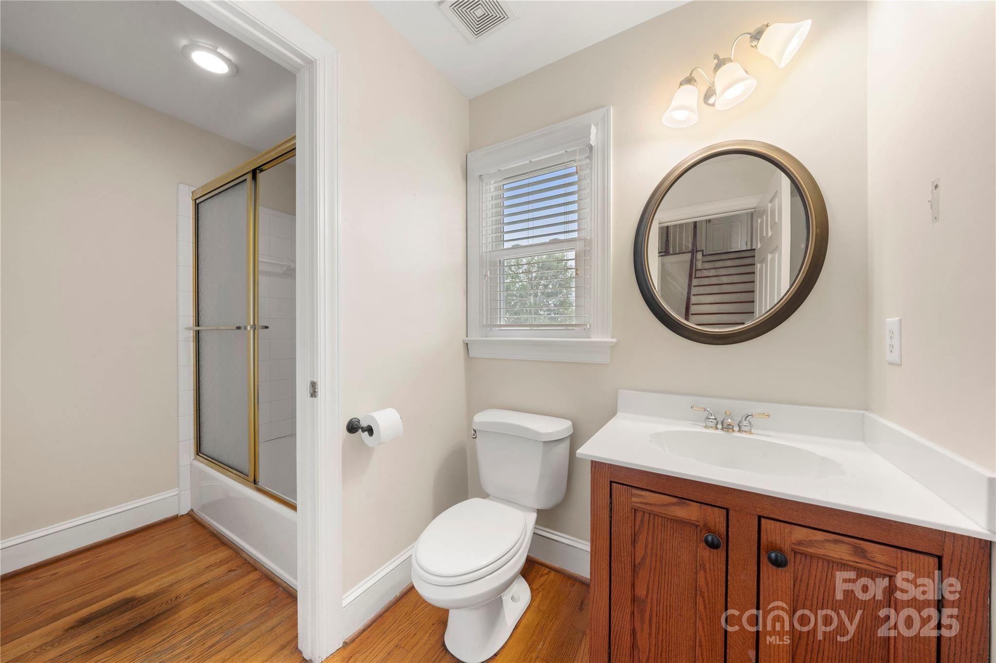 6218 Indian Trail Fairview Road Indian Trail, NC 28079 - Photo 23 of 46 a bathroom with a toilet a sink and a mirror