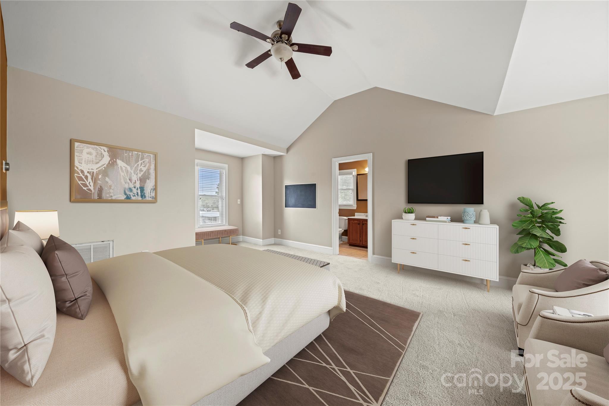 6218 Indian Trail Fairview Road Indian Trail, NC 28079 - Photo 25 of 46 a bedroom with a bed a flat screen tv and a couch