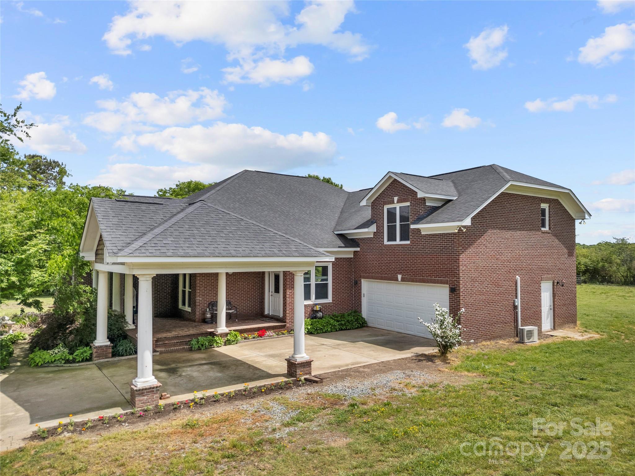 6218 Indian Trail Fairview Road Indian Trail, NC 28079 - Photo 29 of 46 front view of a house with a yard