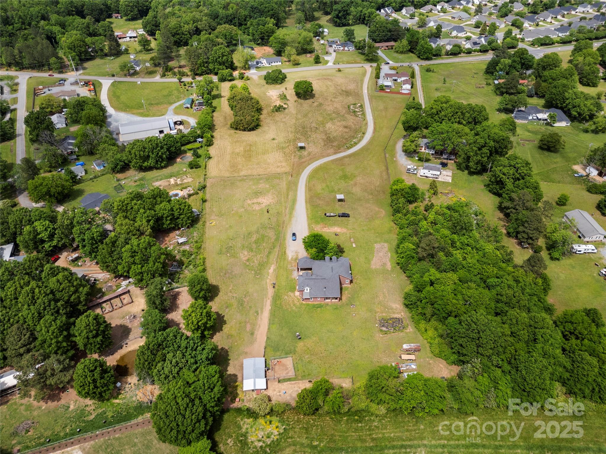 6218 Indian Trail Fairview Road Indian Trail, NC 28079 - Photo 30 of 46 an aerial view of residential house with yard and outdoor seating