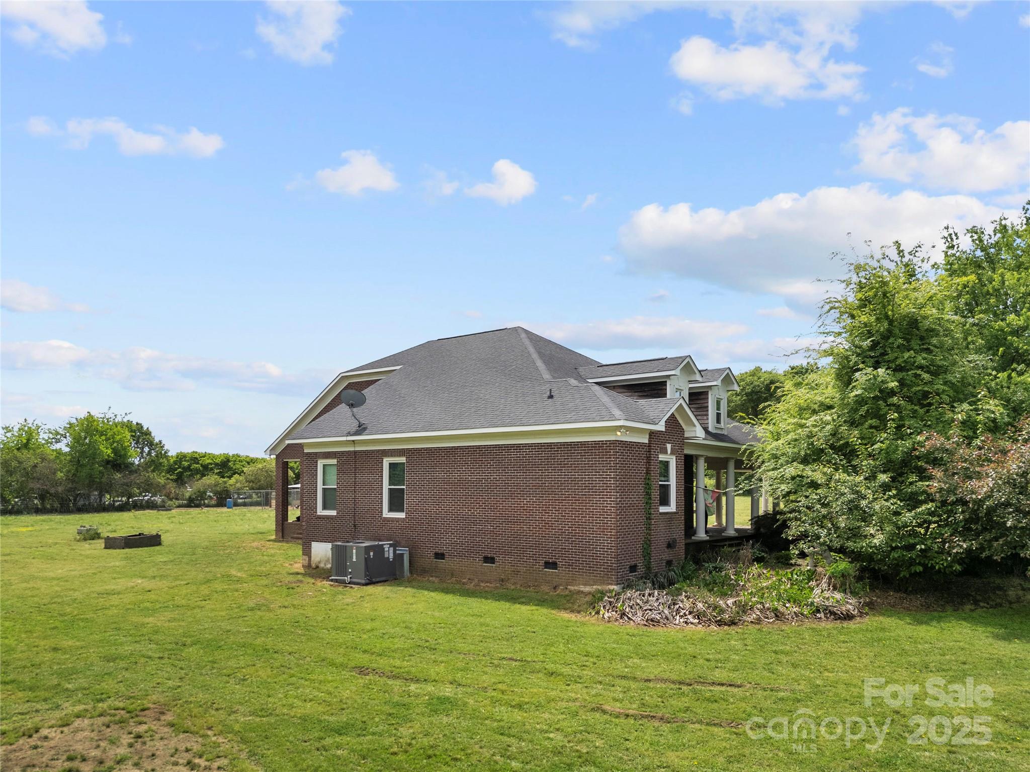 6218 Indian Trail Fairview Road Indian Trail, NC 28079 - Photo 36 of 46 a front view of a house with garden